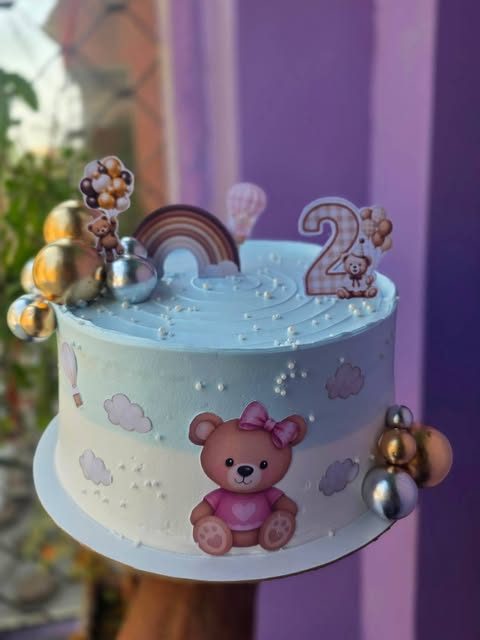 Teddy and rainbow second birthday cake