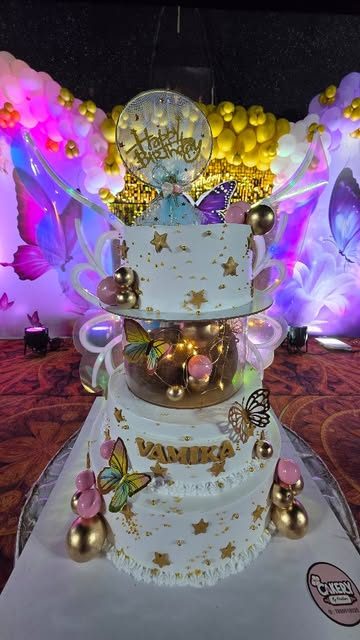 White and gold two-tier cake at a party